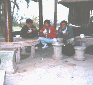 A picture of us eating noodles in the Squatting Position